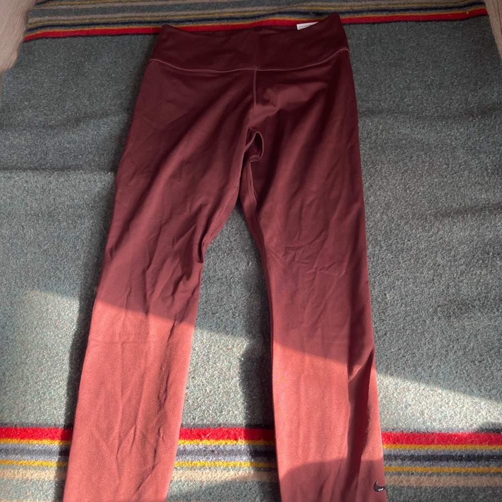 Nike One Luxe legging. Reddish brown new with tags